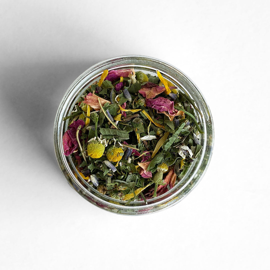 Top-down view of Poet Herbal Tea featuring lemon verbena, chamomile, rose petals, and more.