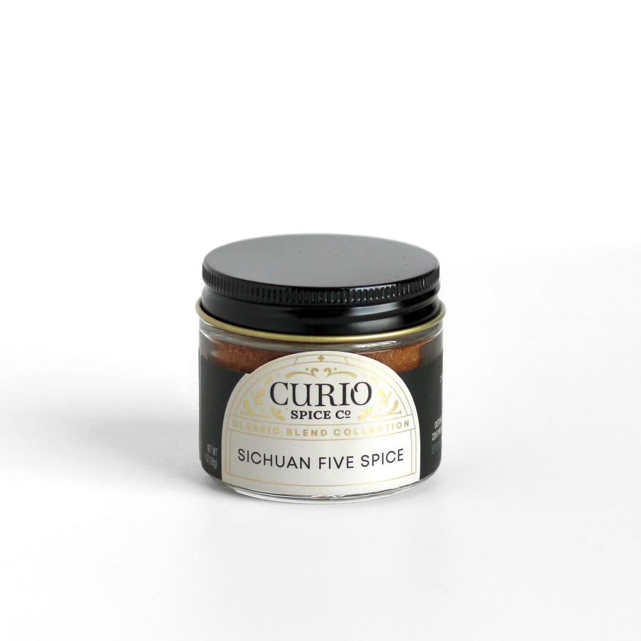 A glass jar of Sichuan Five Spice, our take on Chinese Five Spice with coriander, cassia, star anise, clove, and Sichuan pepper.