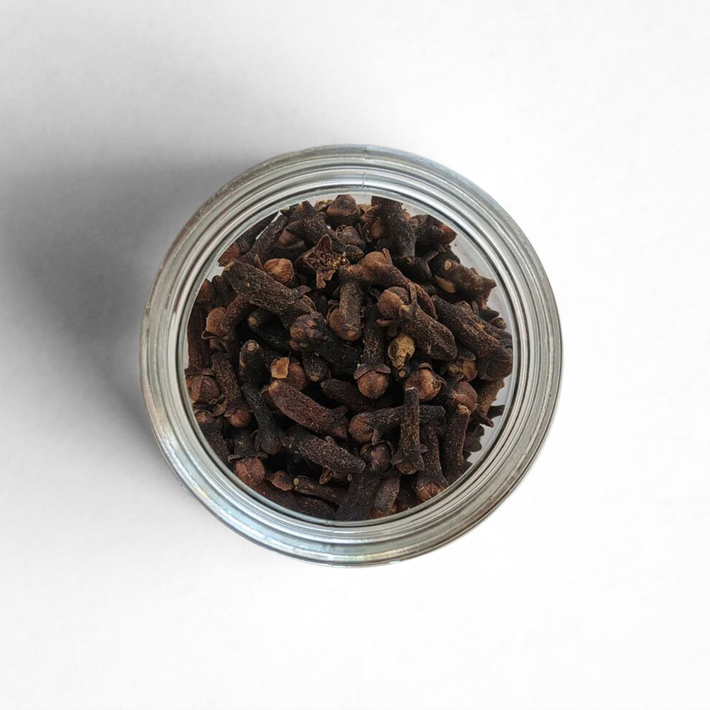 Top-down view of dried clove buds from Sri Lanka.