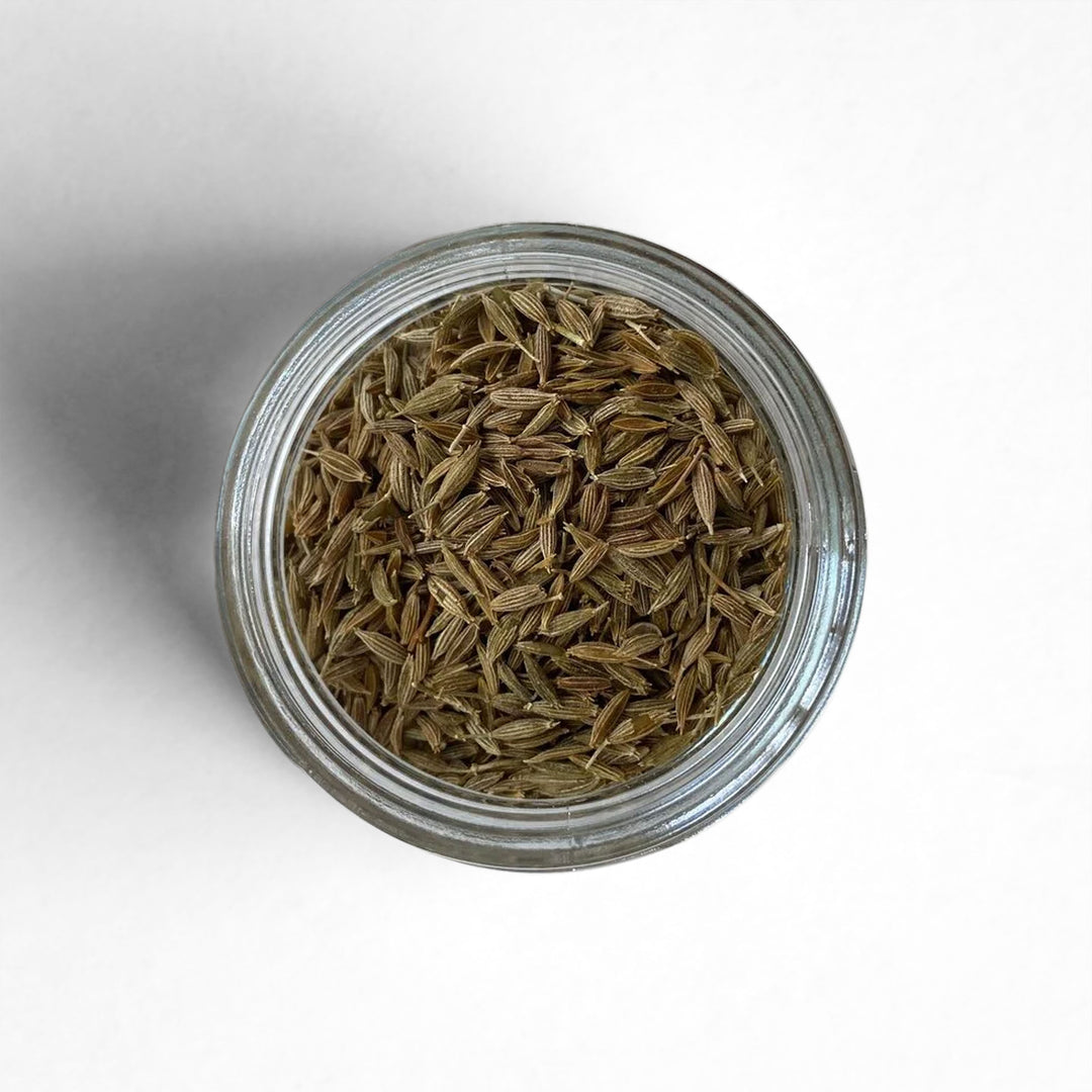 Curio Spice Co. fair-trade single origin sustainable Indian cumin seed in a glass jar from above.