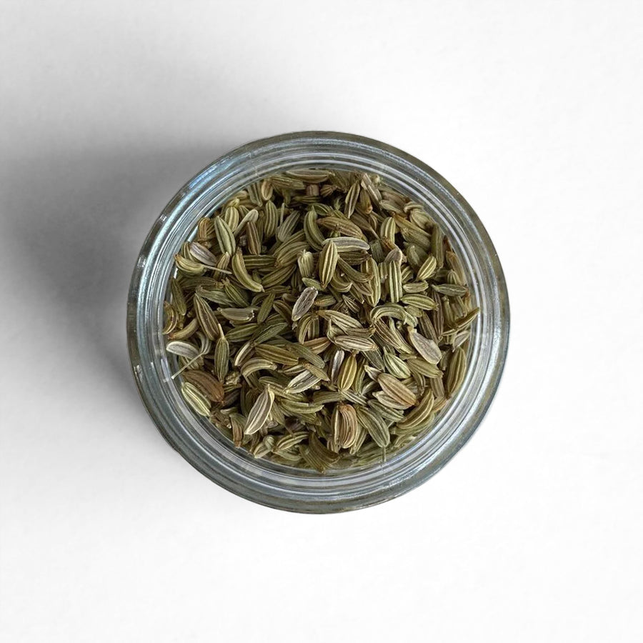 Curio Spice Co. fair-trade single origin sustainable fennel seed in a glass jar from above.
