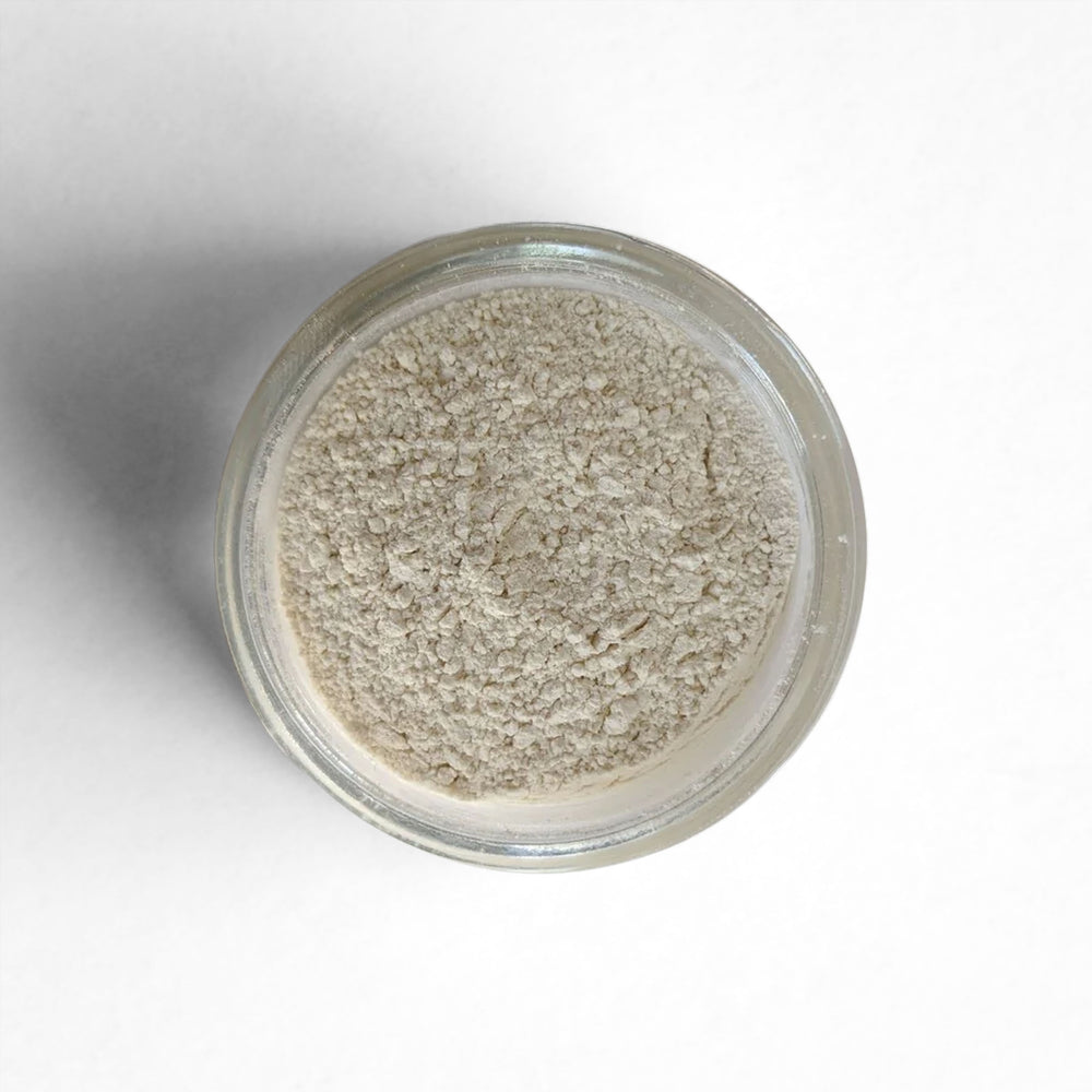 Curio Spice Co. fair-trade single origin sustainable onion powder in a glass jar from above.