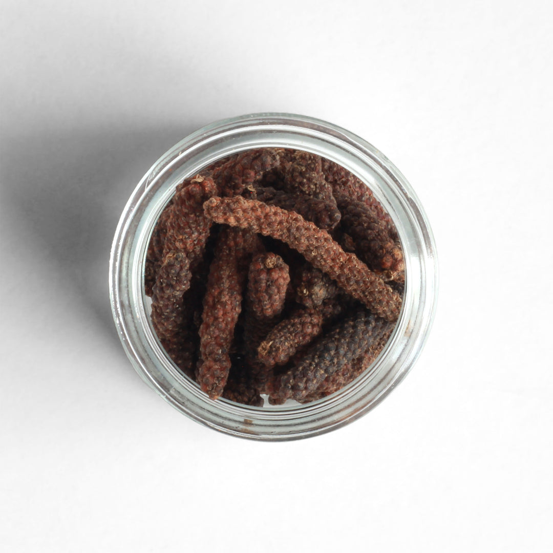 Top-down view of Kampot Long Red Peppercorns