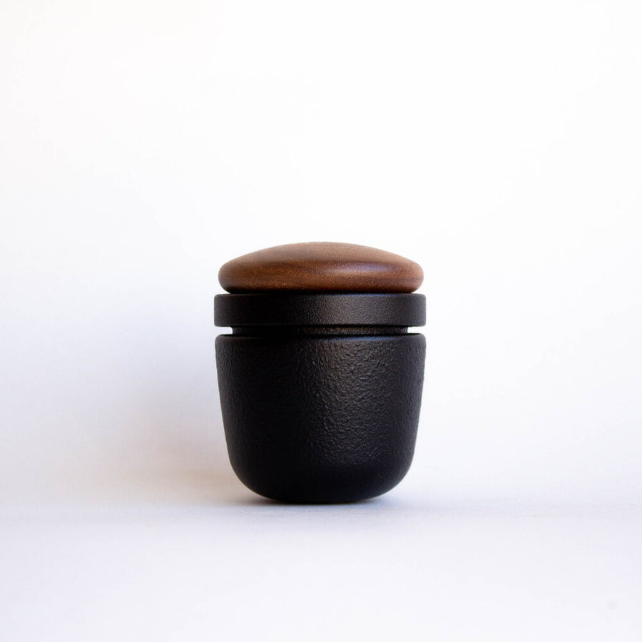 Cast iron and wood hand spice grinder.