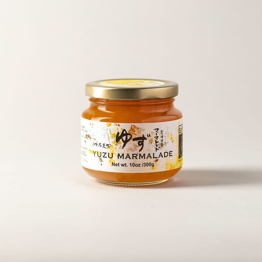 Jar of Yuzu Marmalade with a gold lid.