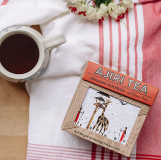 Ajiri Tea Organic Rooibos with a brewed cup.